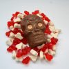 chocolate skull with orange eyes on jelly bones