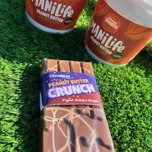 peanut butter crunch with mani life peanut butter tubs on grass