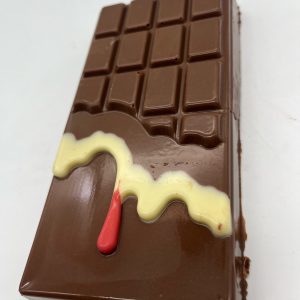 Milk chocolate bar with white chocolate and pink choclate drip