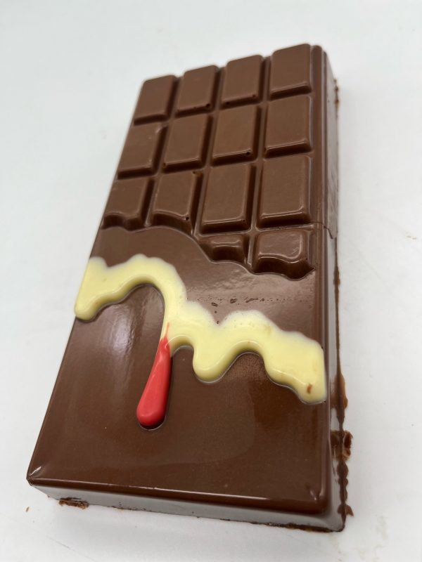 Milk chocolate bar with white chocolate and pink choclate drip