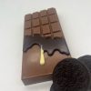 milk chocolate bar with dark and white chocolate drips