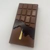 milk chocolate bar with dark and white chocolate drips