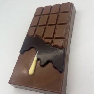 milk chocolate bar with dark and white chocolate drips