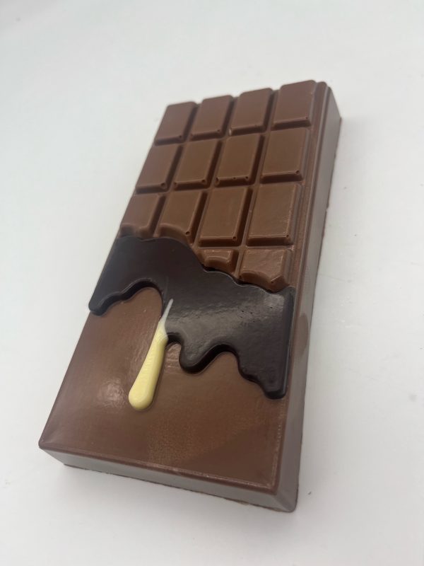 milk chocolate bar with dark and white chocolate drips