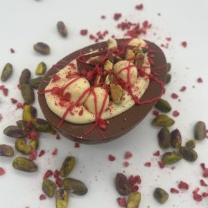 raspberry pistachio half easter egg milk chocolate