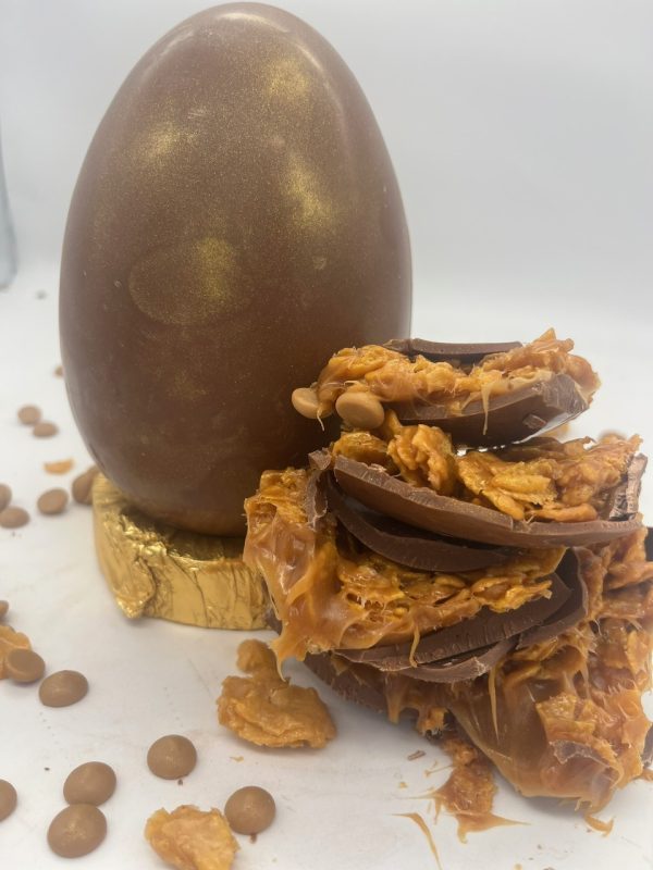 golden shimmer chocolate egg with caramel and cornflake filling easter egg