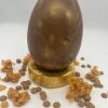 golden shimmer chocolate egg with caramel and cornflake filling easter egg