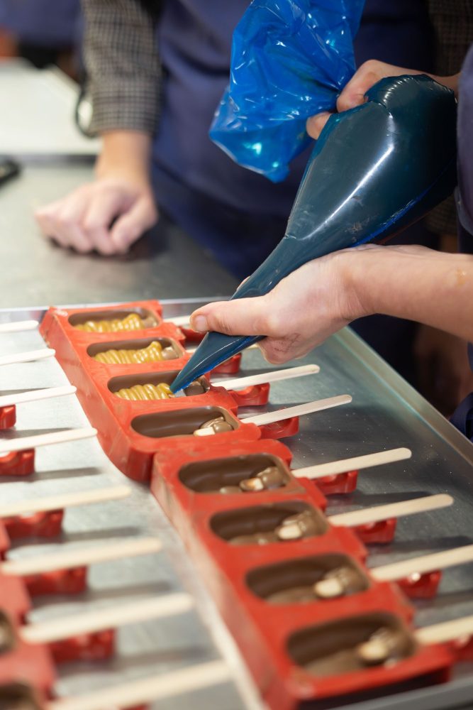 chocolate pouring into moulds