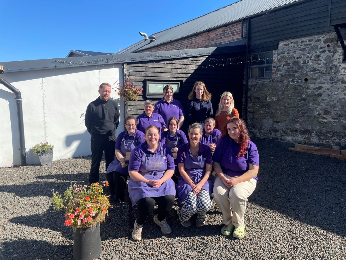 group picture outside the marquee